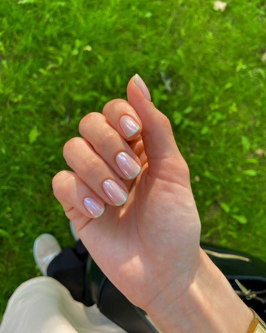 Chic green french tips with a glossy finish