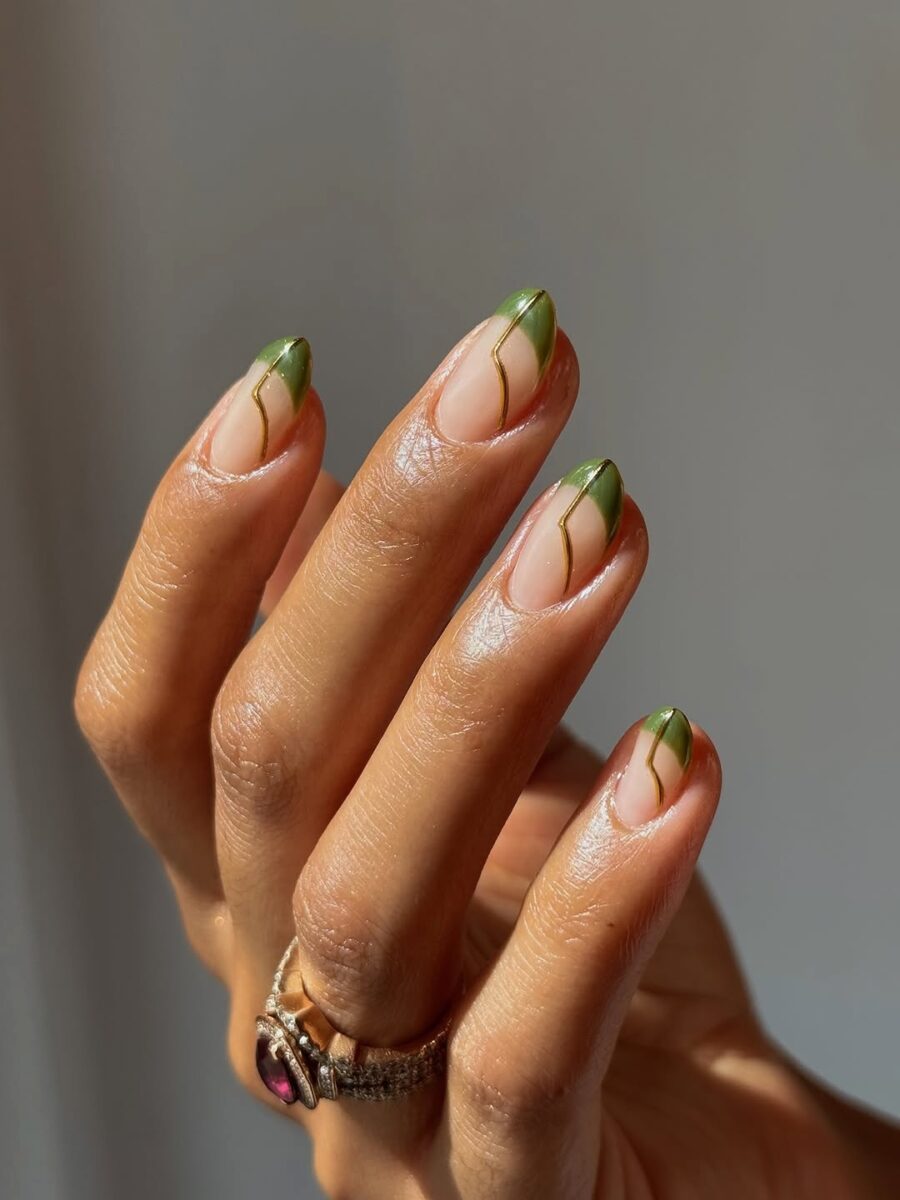 Chic green French tip nail design with accents