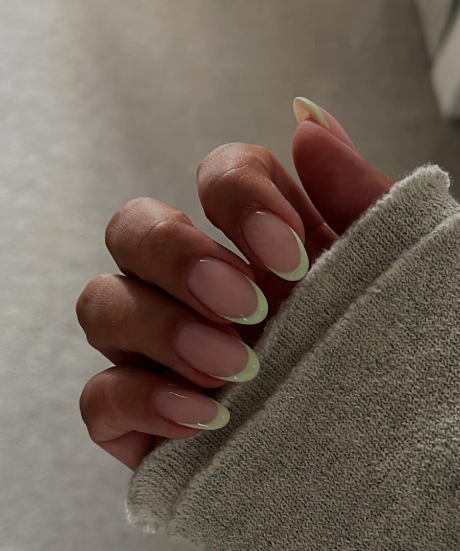 Stylish green French tip manicure on nails