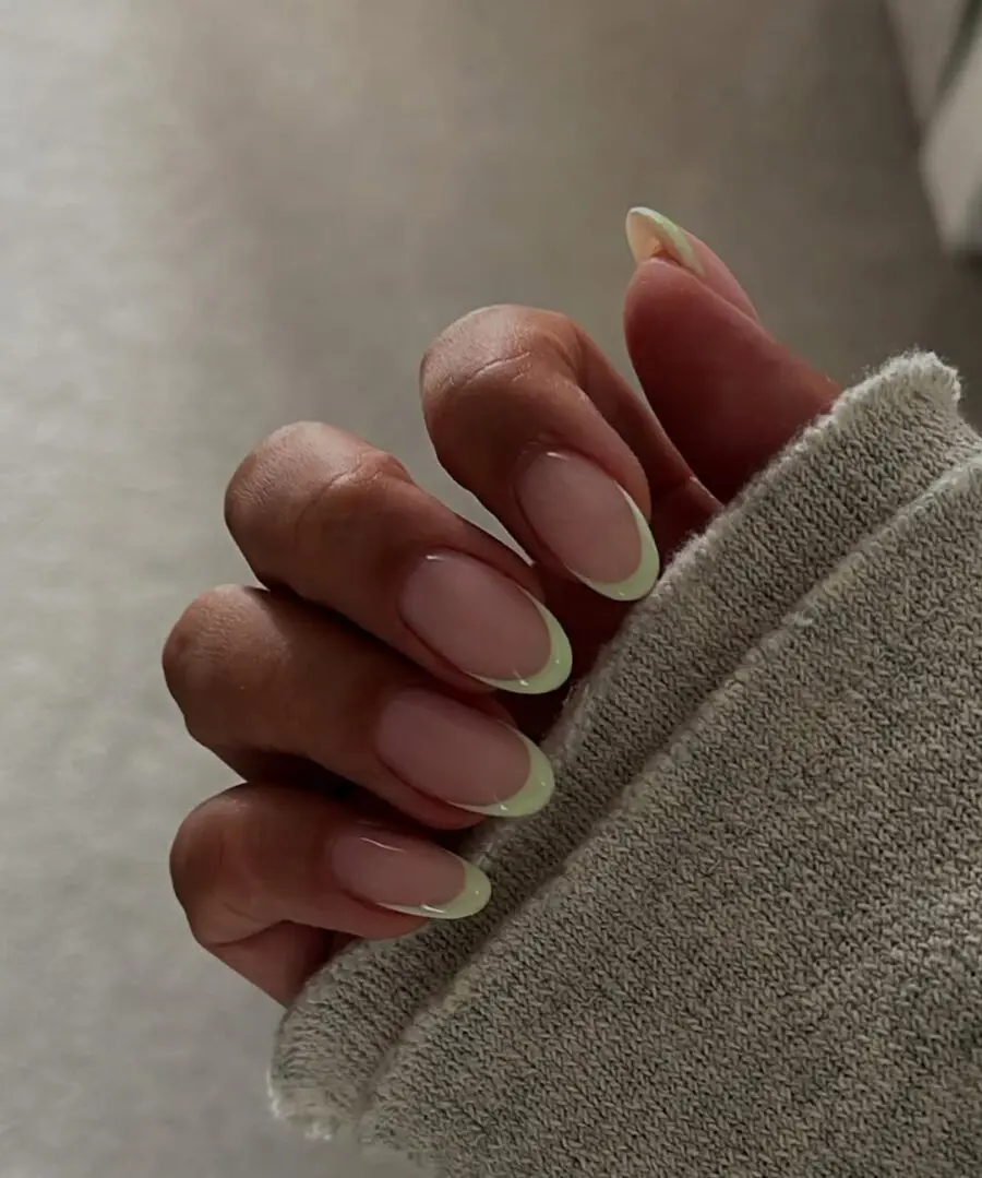 Stylish green French tip manicure on nails