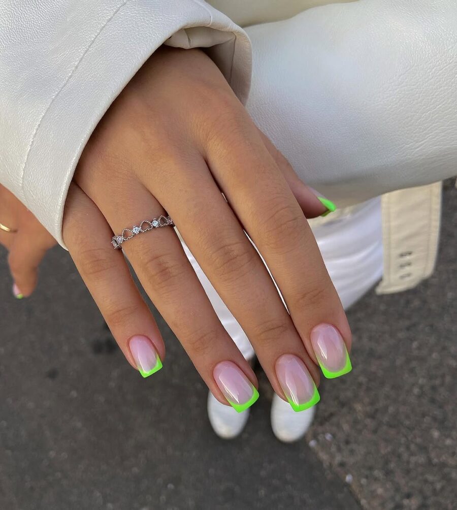 Stylish green French tip nails for a chic look