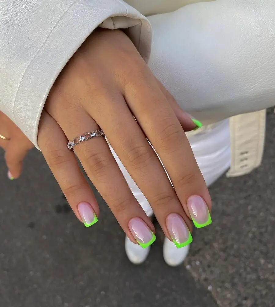 Stylish green French tip nails for a chic look