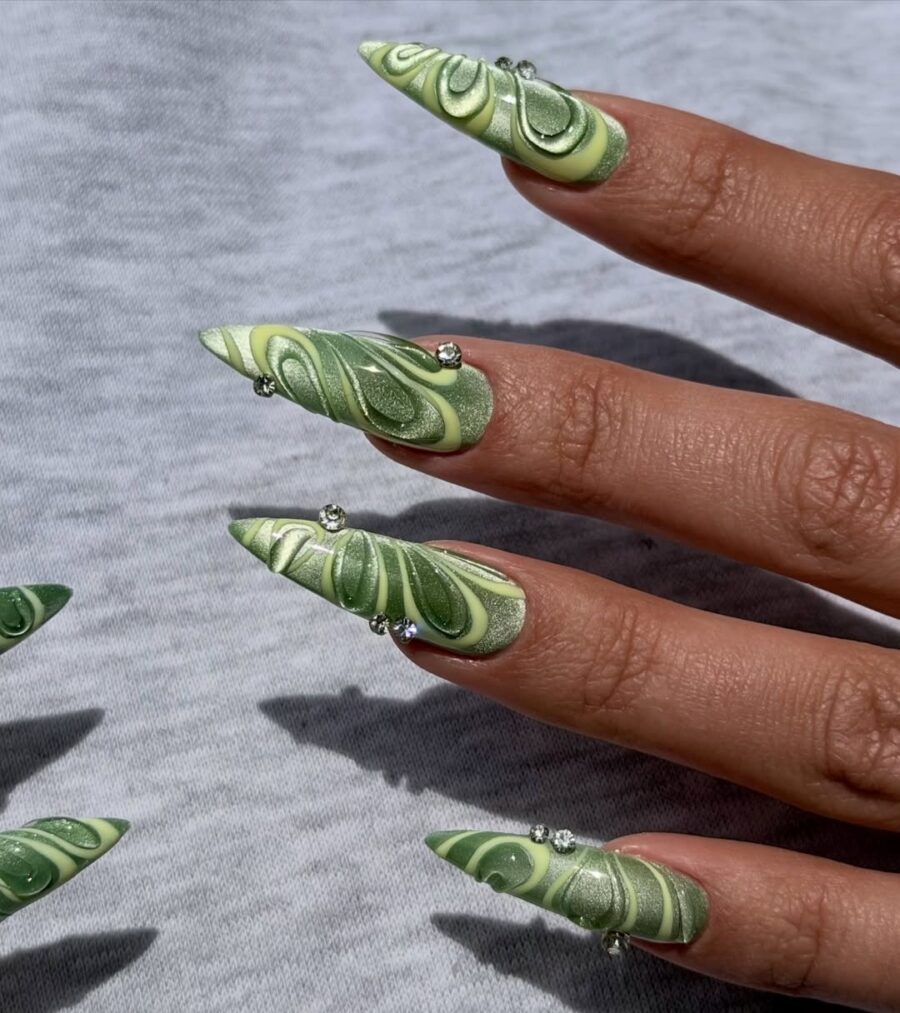 Chic green velvet nail art with dazzling accents