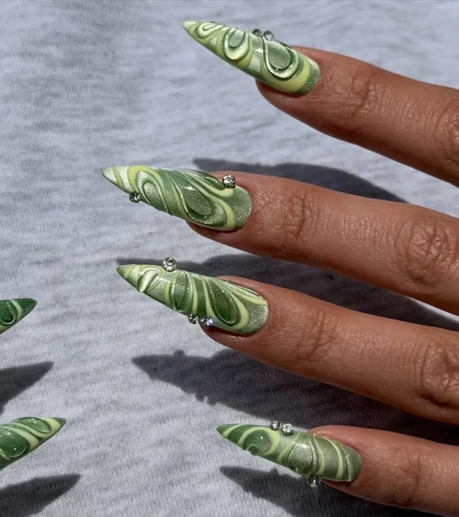 Chic green velvet nail art with dazzling accents