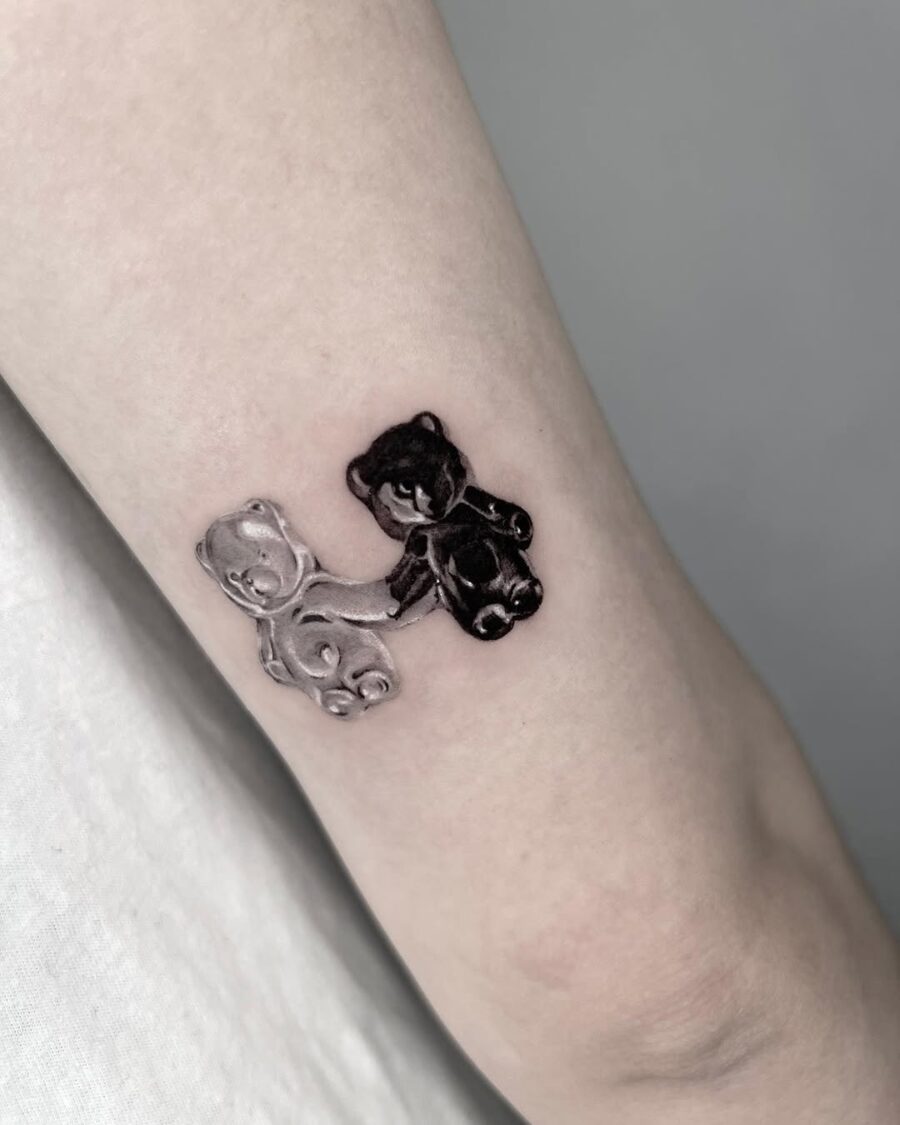 Charming black and white gummy bear duo tattoos