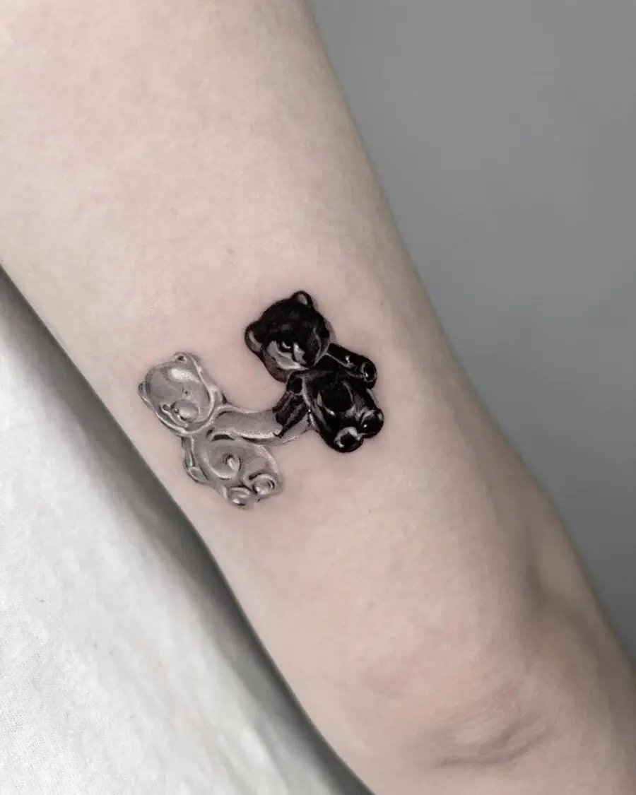 Charming black and white gummy bear duo tattoos