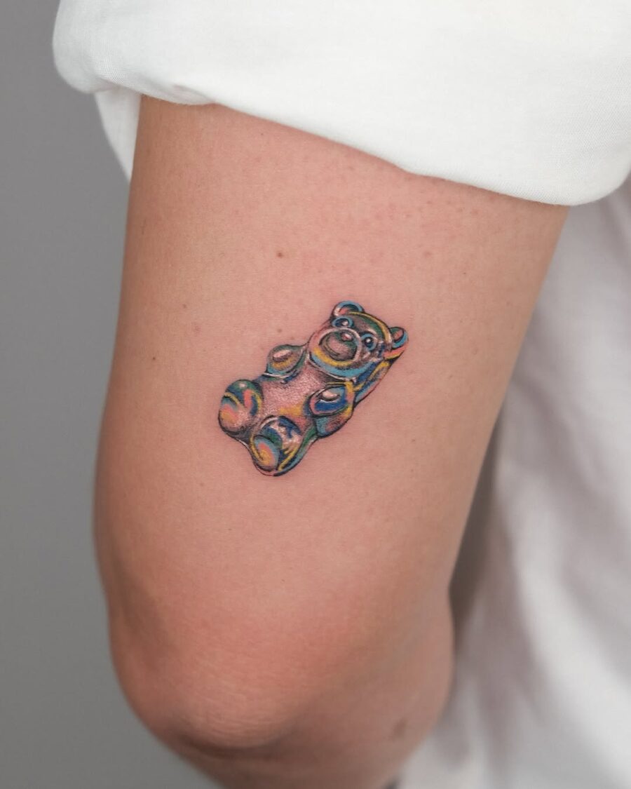 Colorful gummy bear tattoo on the arm