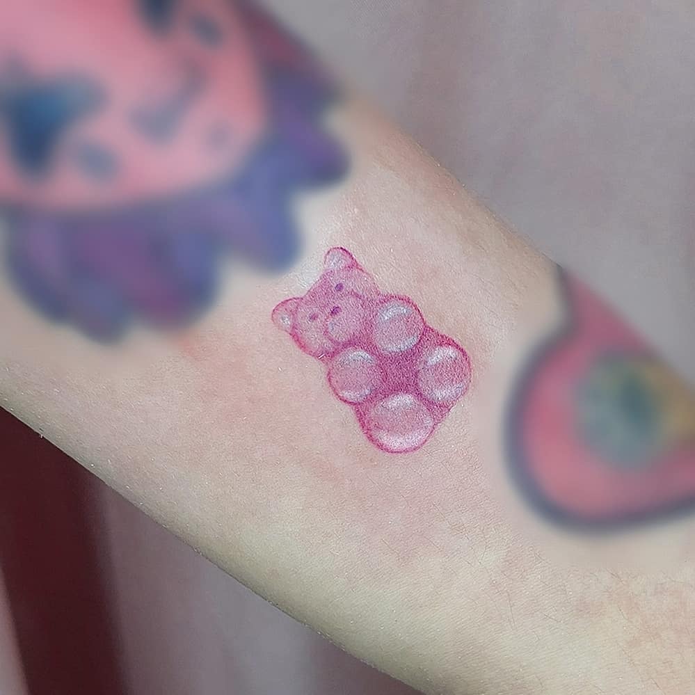 Charming gummy bear tattoo in vibrant pink