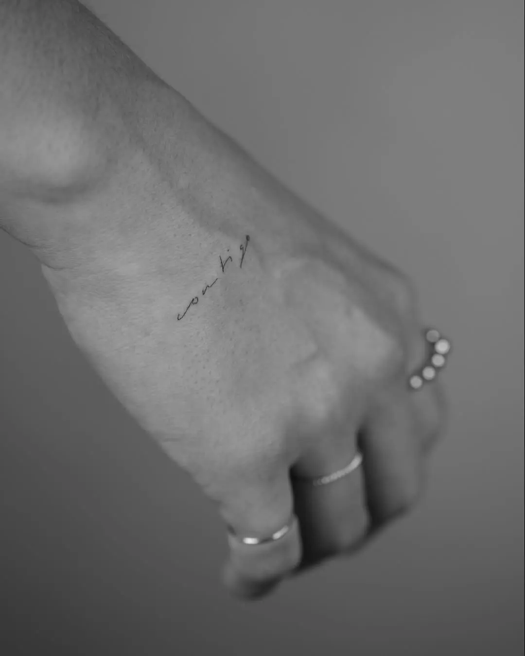 Elegant handwriting tattoo on wrist area