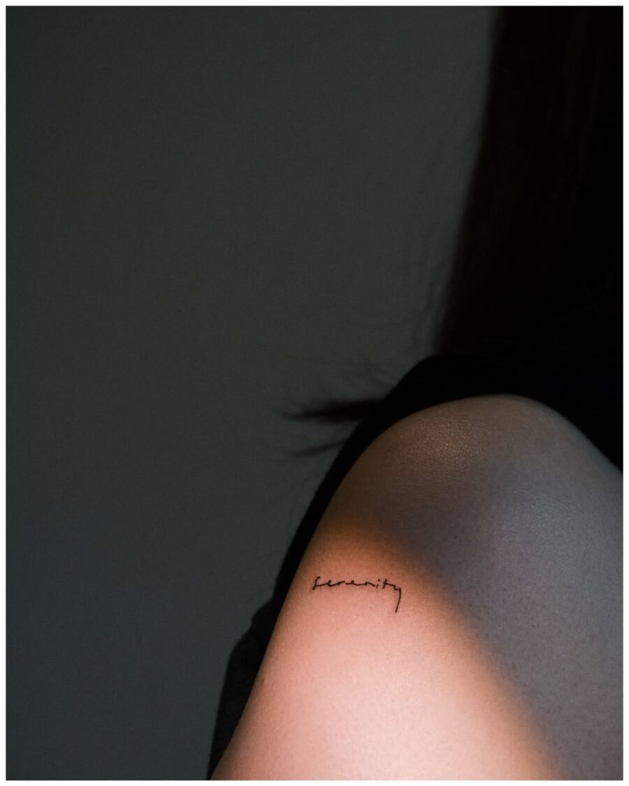 Elegant handwriting tattoo on the forearm