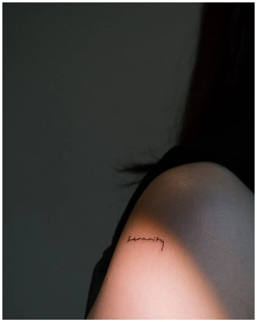 Elegant handwriting tattoo on the forearm