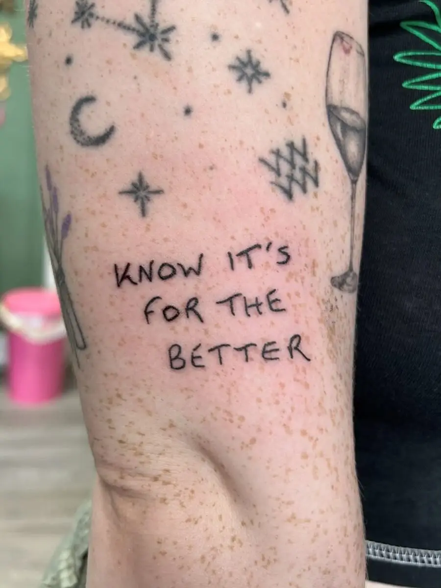 Minimalistic tattoo with an uplifting message