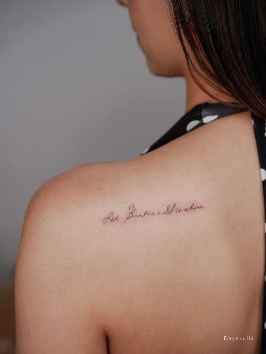 Elegant Script Tattoo: 'Live Free, Love Hard'