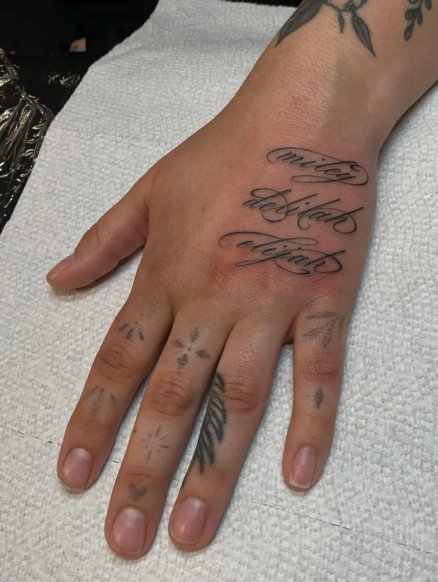 Elegant Handwriting Tattoo on the Hand