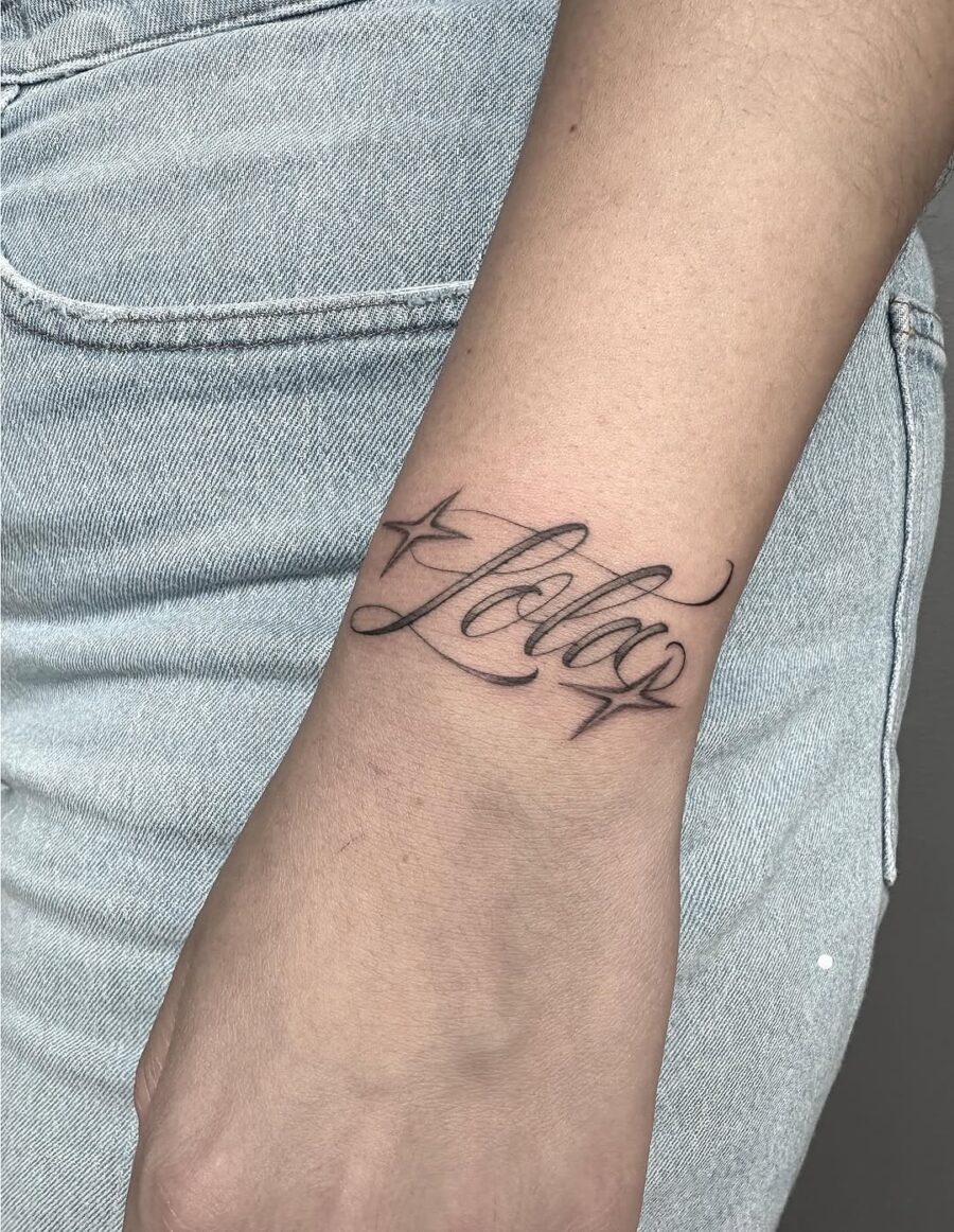 Elegant scripted handwriting tattoo on wrist