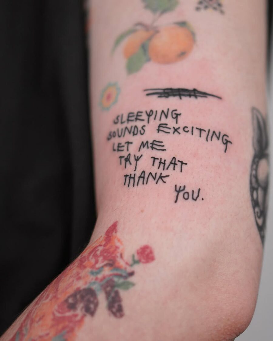 Unique handwritten quote tattoo on forearm