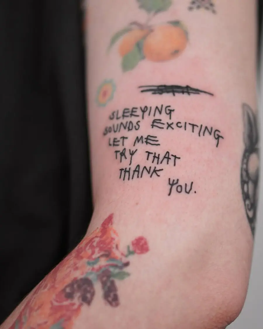 Unique handwritten quote tattoo on forearm