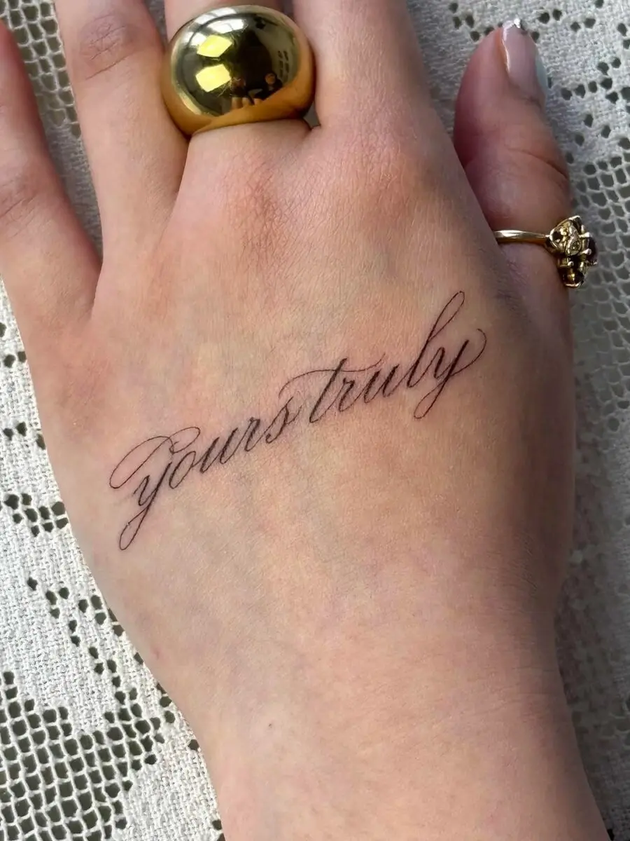 Elegant handwriting tattoo on the wrist