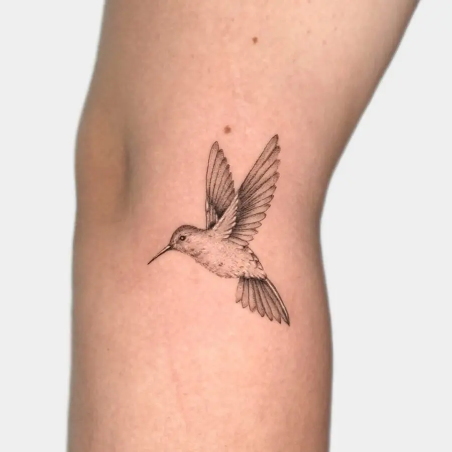 Elegant hummingbird in mid-flight tattoo concept