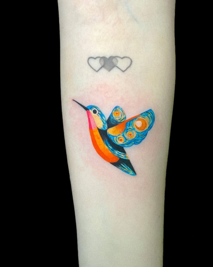 Vibrant hummingbird tattoo with colorful details