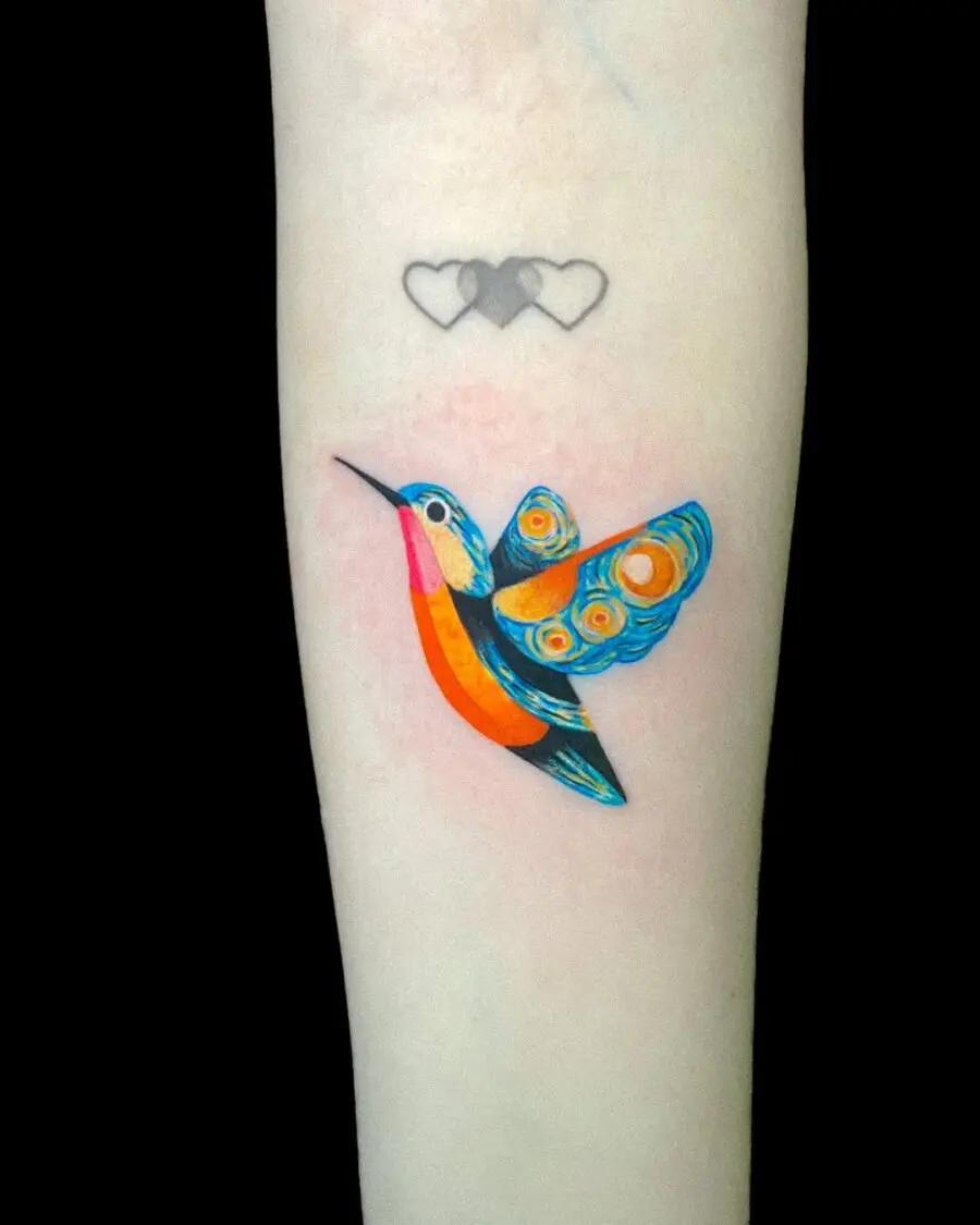 Vibrant hummingbird tattoo with colorful details