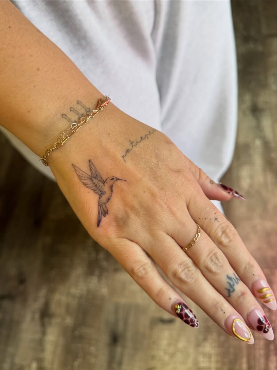 Delicate Hummingbird Tattoo on Hand