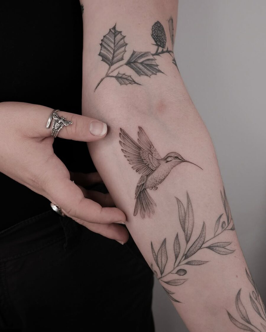 Elegant hummingbird tattoo with intricate detailing