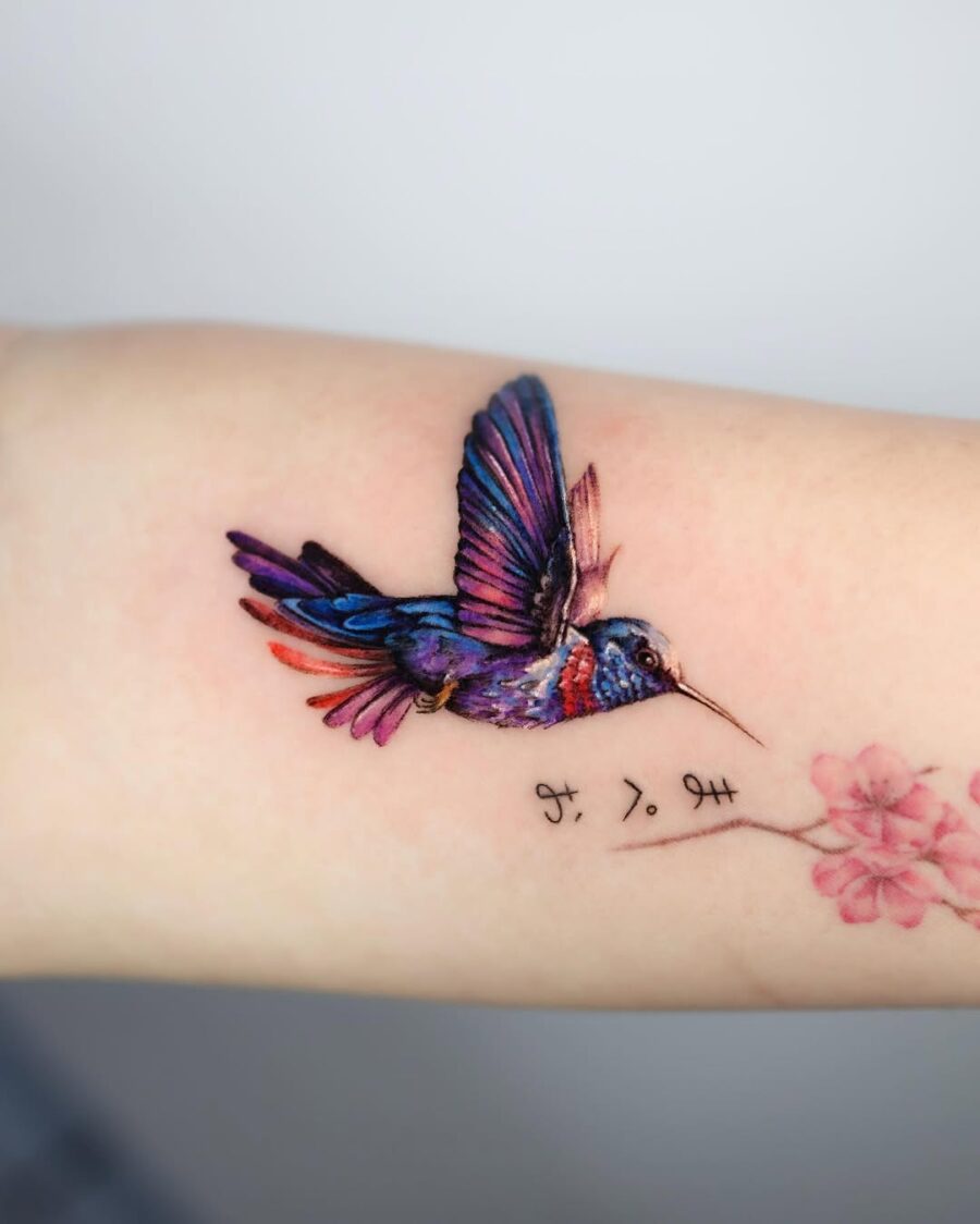 Vibrant hummingbird soaring with floral accents