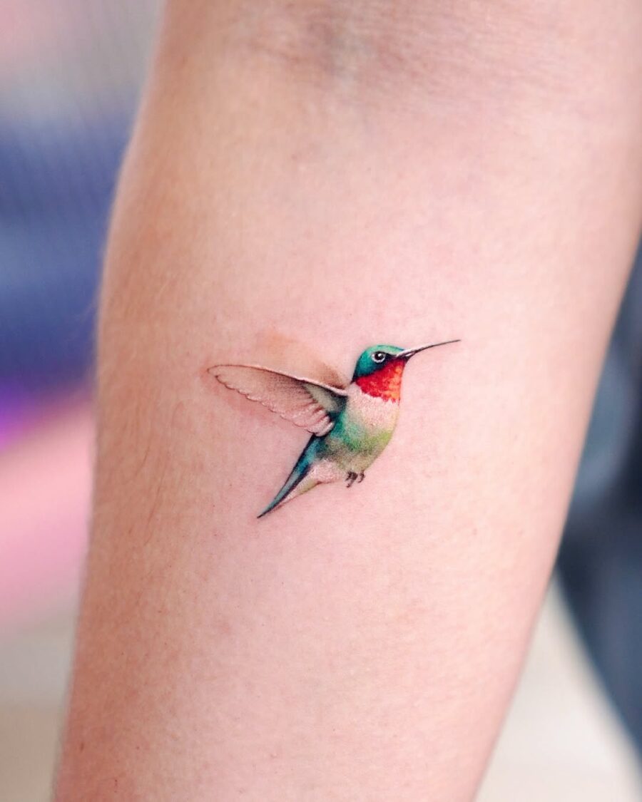 Stunning realistic hummingbird tattoo in vibrant hues