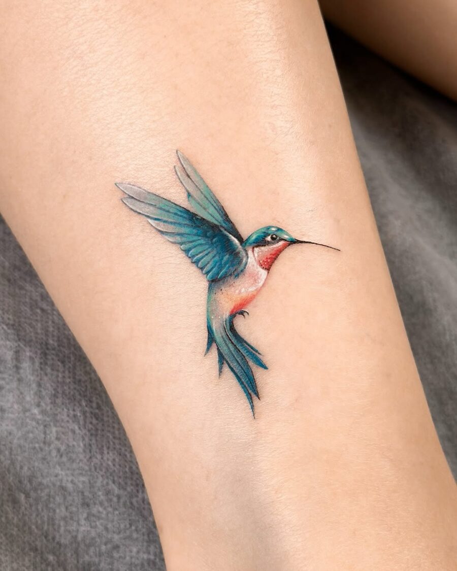 Elegant hummingbird tattoo in vibrant colors