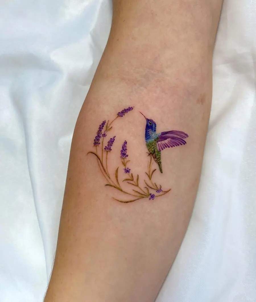 Vibrant hummingbird surrounded by delicate lavender flowers