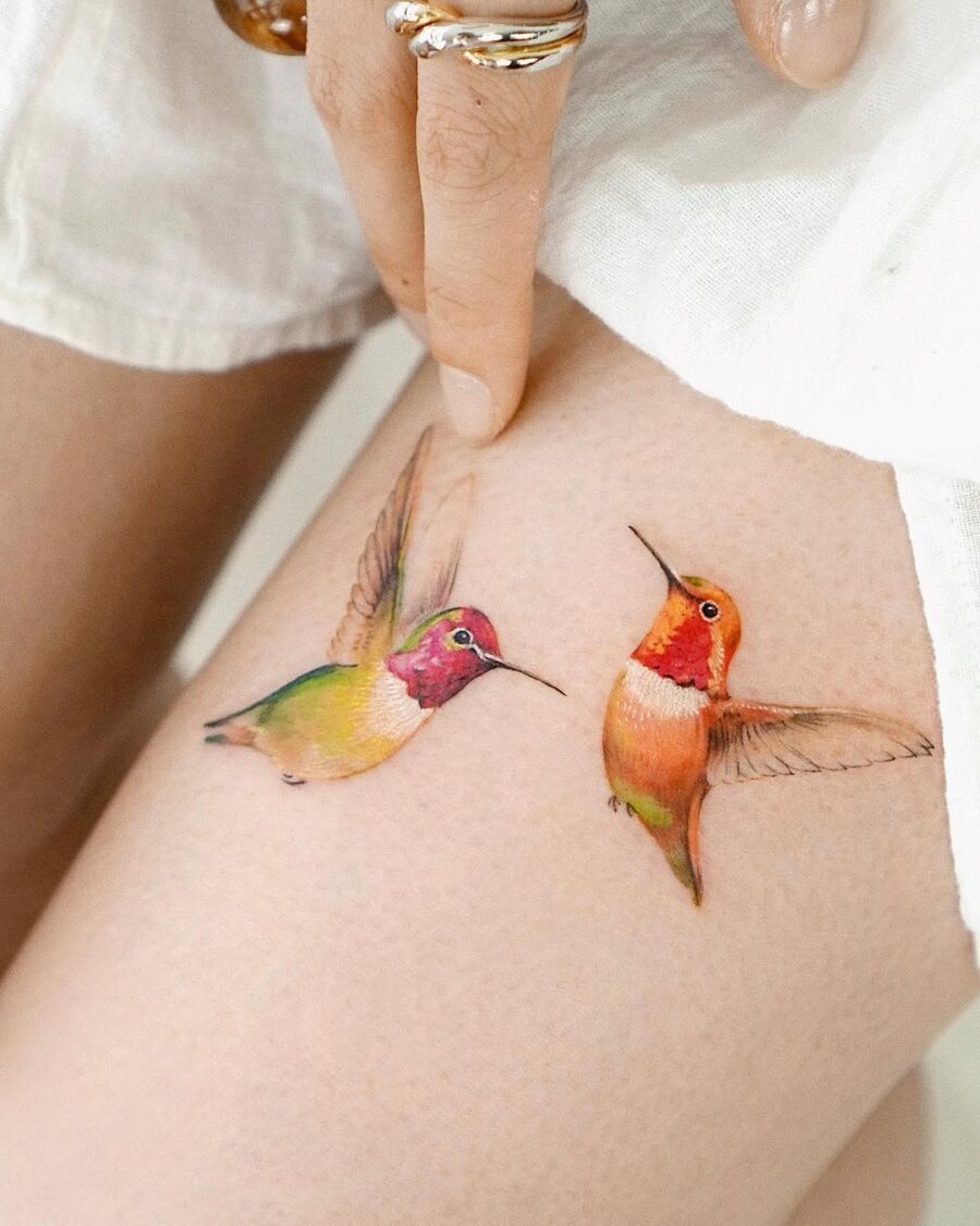 Vibrant hummingbird tattoos with striking colors