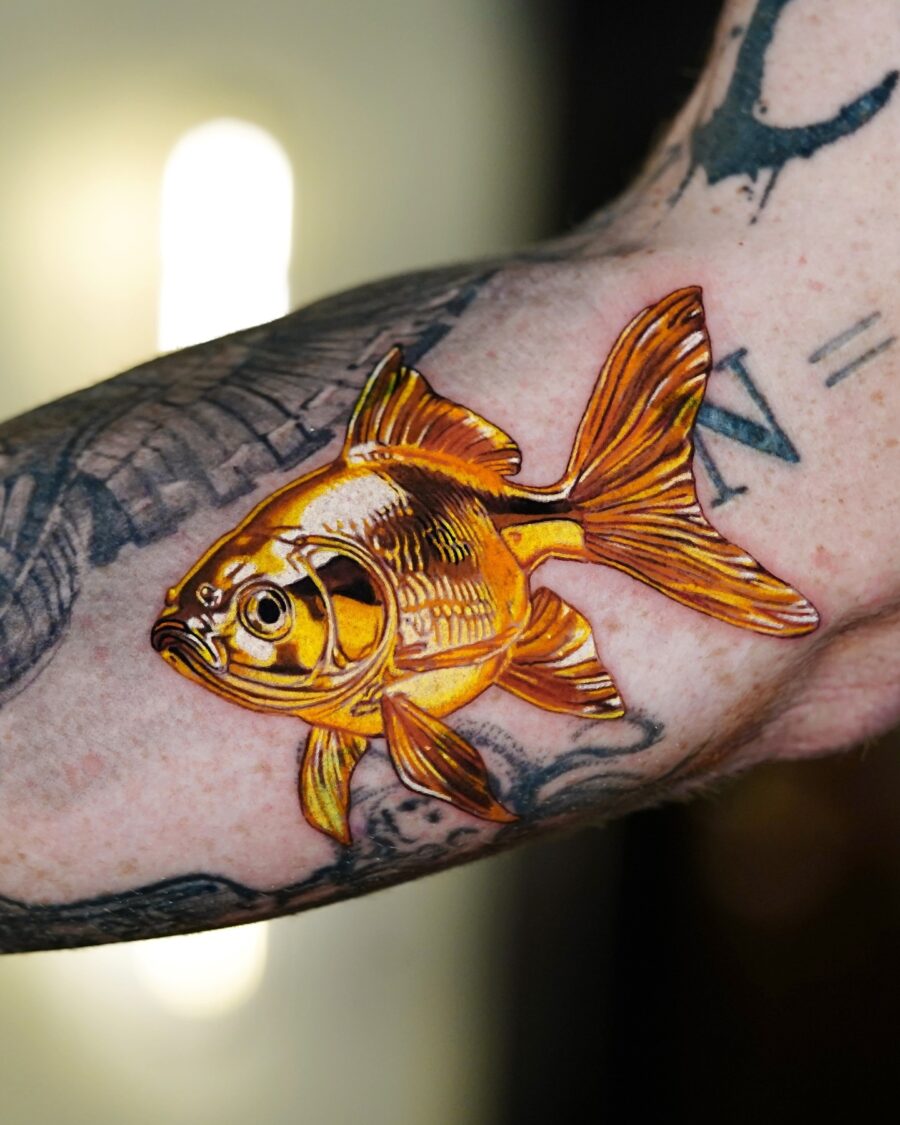 Stunning goldfish tattoo with vibrant detailing