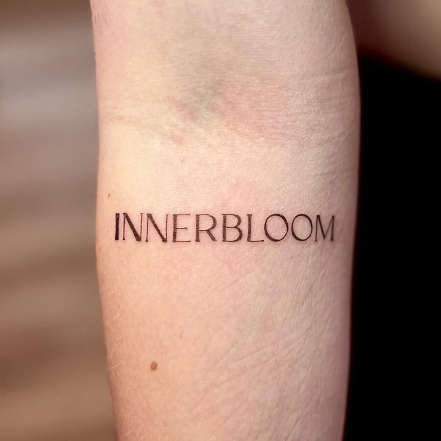 Stylish inner forearm script tattoo design