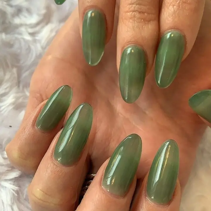 Translucent green jelly nails with almond shape