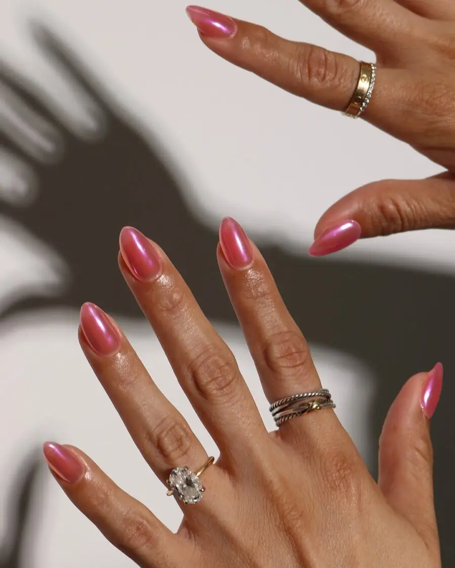 Vibrant pink jelly nails with a glossy finish
