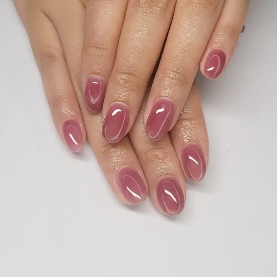 Stylish pink jelly nails with glossy finish