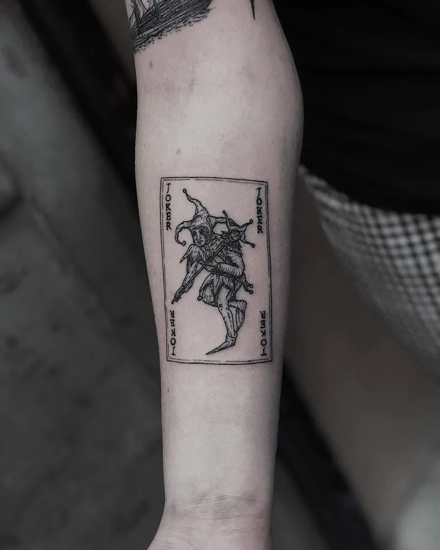 Intricate joker playing card tattoo design