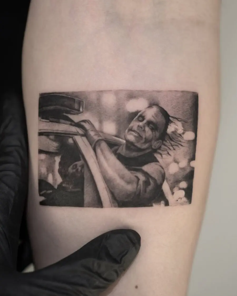 Dramatic Joker Scene Tattoo in Black and Gray