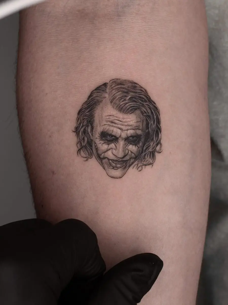 Detailed Joker tattoo capturing his iconic grin