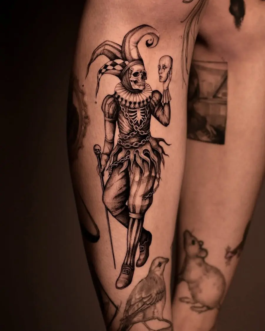 Intricate skeleton clown tattoo design on leg