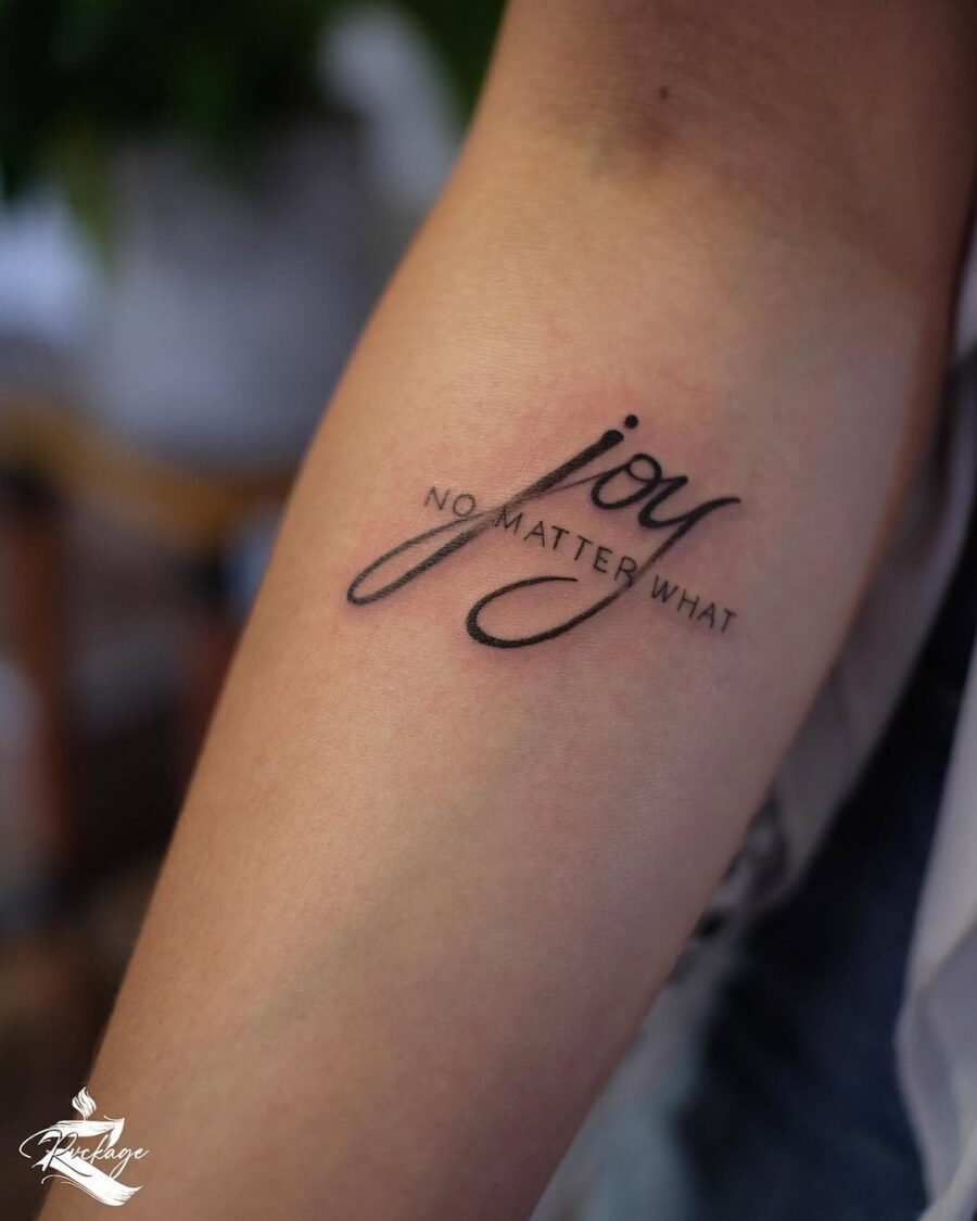 Stylish script tattoo expressing everlasting joy