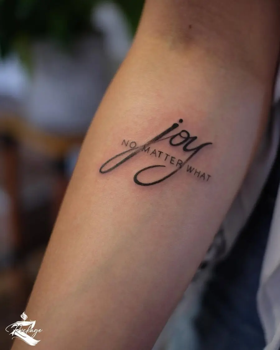 Stylish script tattoo expressing everlasting joy