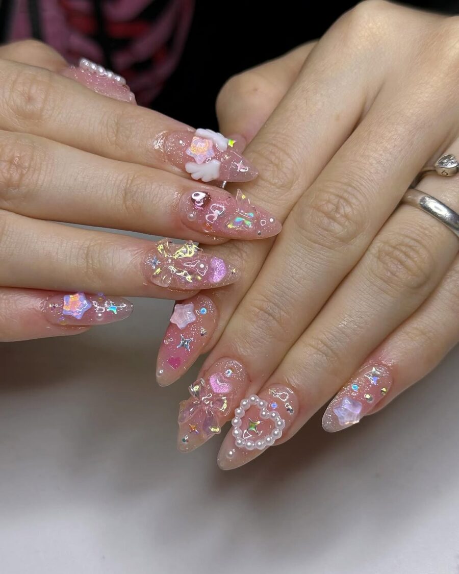 Charming pink nails with playful floral designs