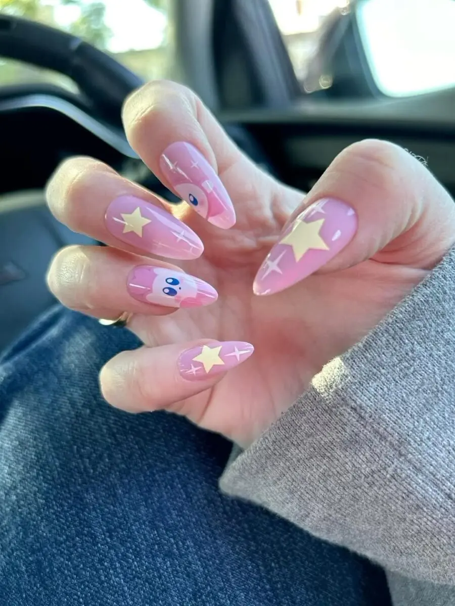 Adorable pink nails with stars and cartoon vibes