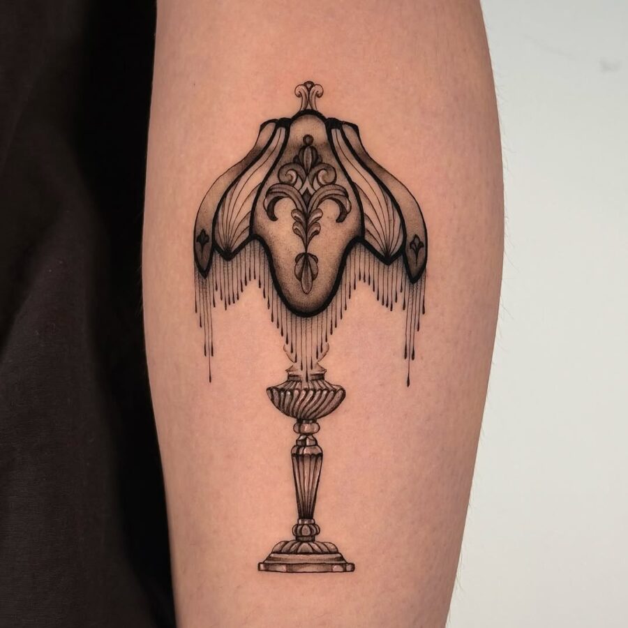 Elegant lamp tattoo with intricate design details