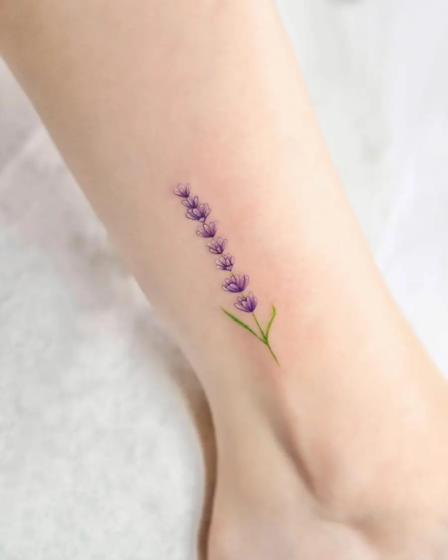 Delicate lavender tattoo accentuating the ankle