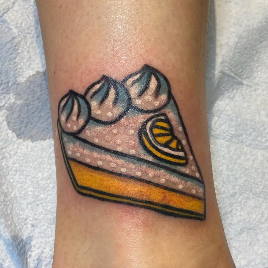 Vibrant lemon meringue pie tattoo on display
