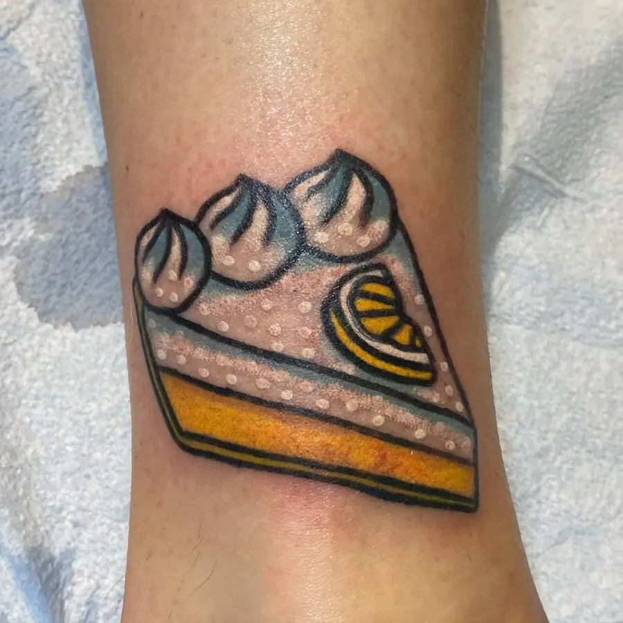 Vibrant lemon meringue pie tattoo on display