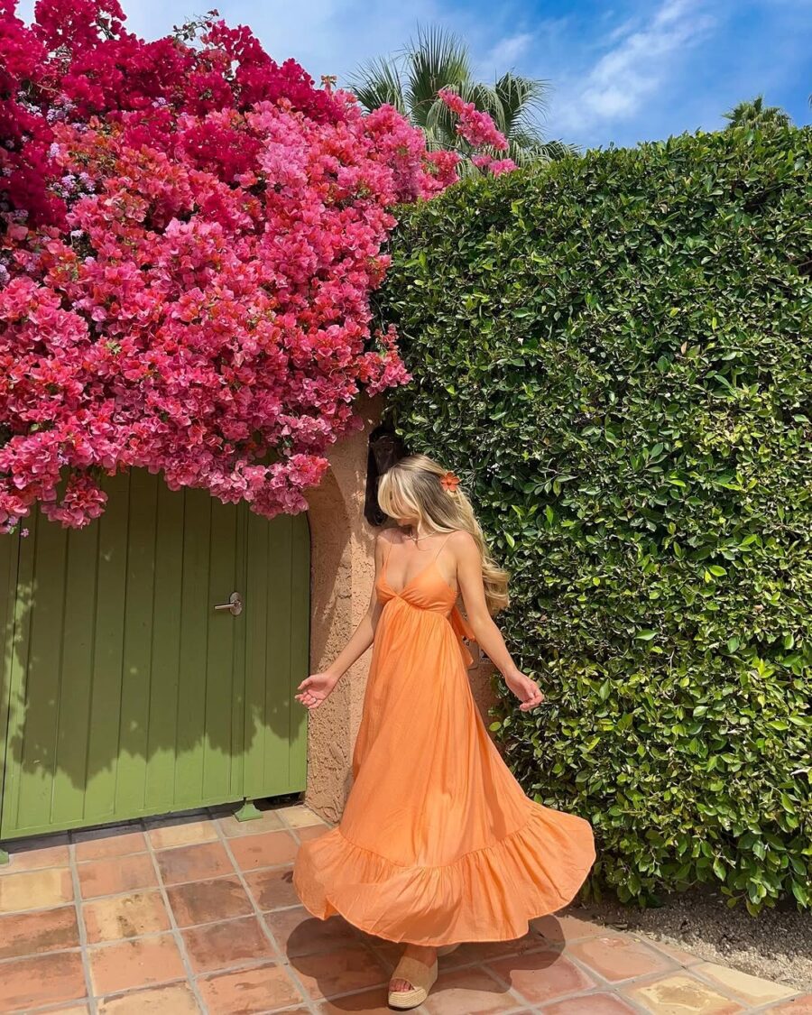 Effortless summer vibes with a flowy orange dress